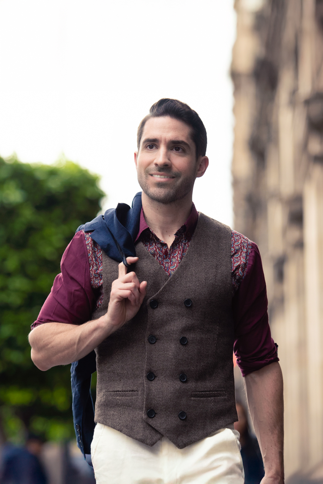 Ryan H Gray, owner of Moment Makers Photography, walking in the streets of Mexico City looking fashionable