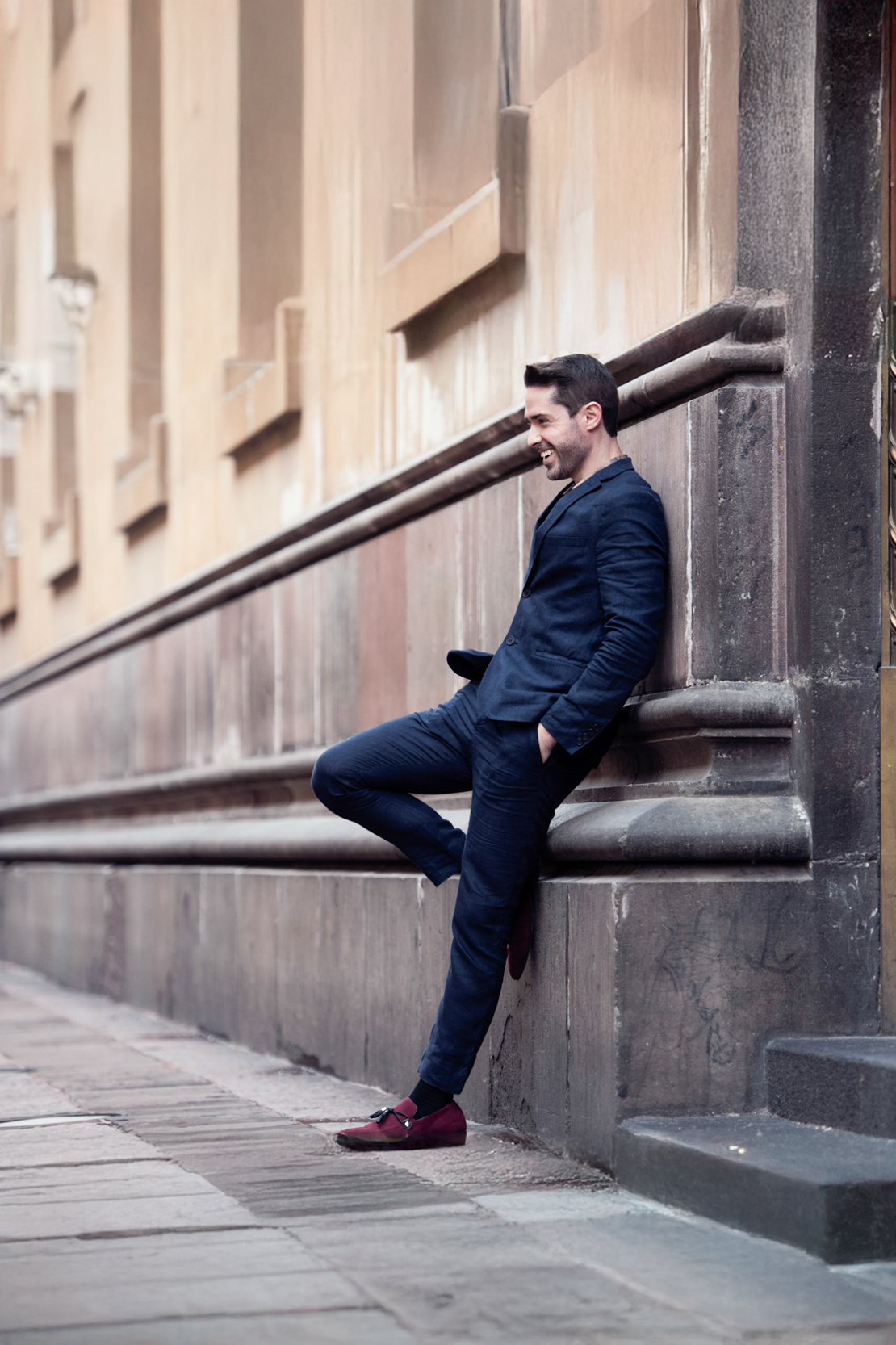 Ryan H Gray with Shades of Gray Photography smiling in alley way in Mexico City-Edit